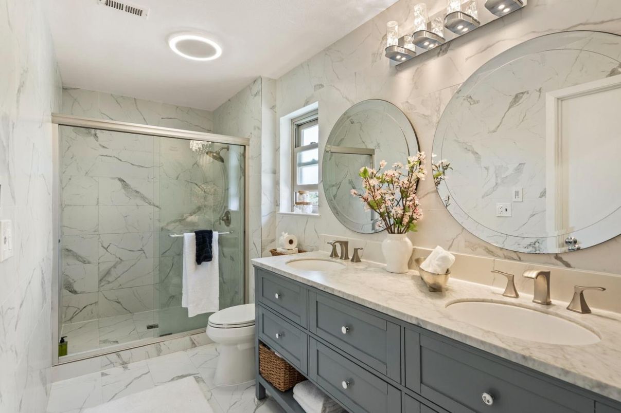 Bathroom, Dual Sink Vanities, Glass Shower, Interior, Marble, Marble Walls, Recessed Lighting