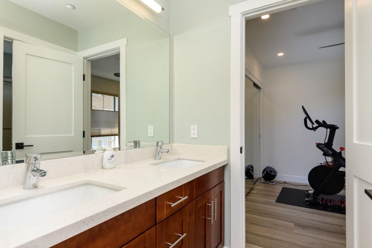 Bathroom, Dual Sink Vanities, Fitness Equipment, Interior, Recessed Lighting, Wood Texture Flooring