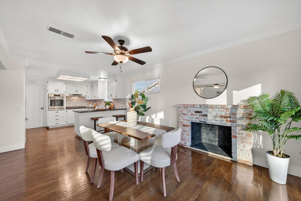 Dining room, Fireplace, Interior, Kitchen, Stainless Steel Appliances, Wood Texture Flooring