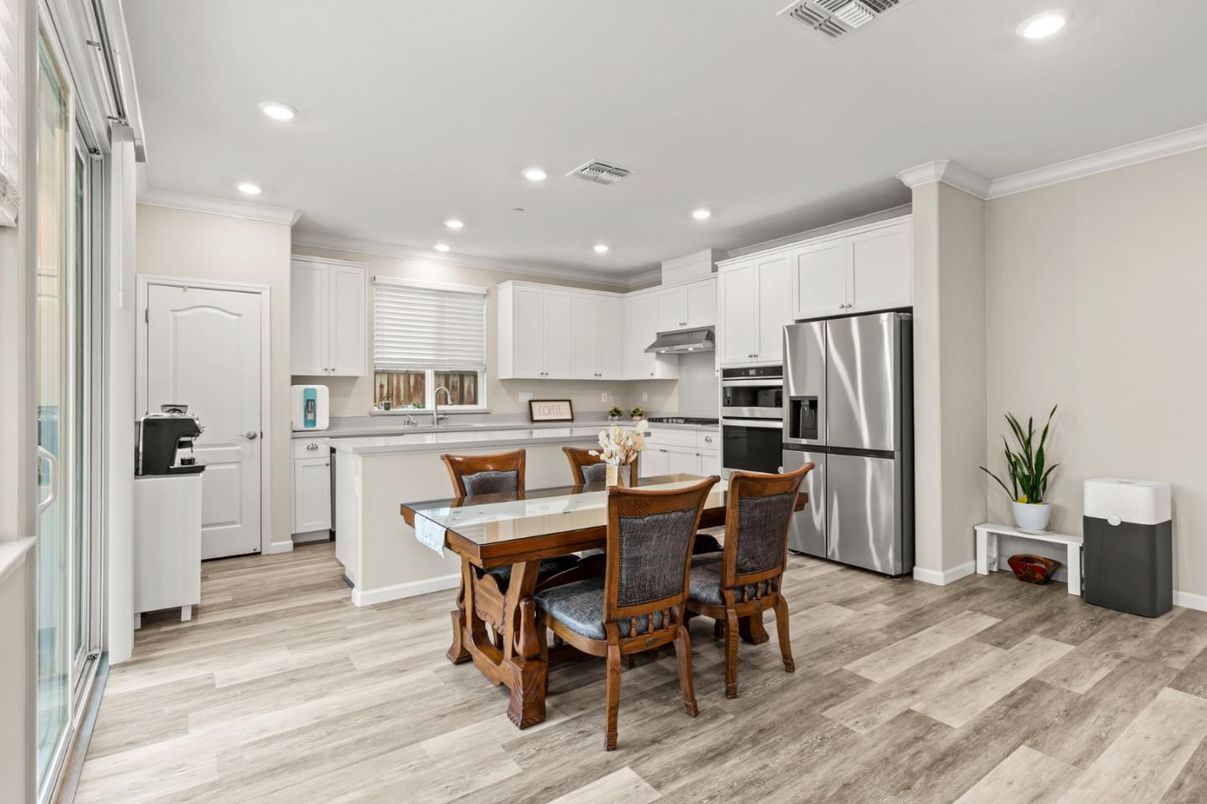 Dining room, Interior, Kitchen, Recessed Lighting, Stainless Steel Appliances, Wood Texture Flooring