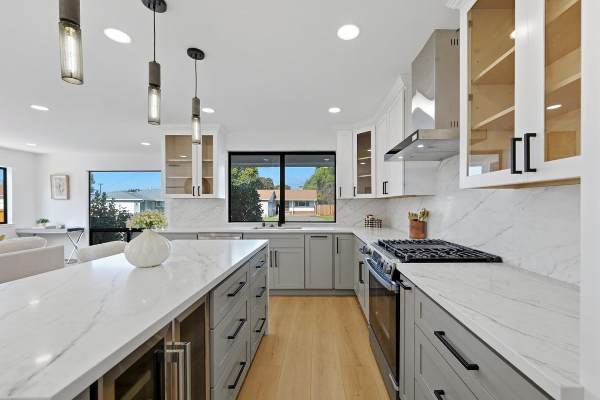 Interior, Kitchen, Marble Walls, Pendant Lights, Recessed Lighting, Stainless Steel Appliances, Wood Texture Flooring