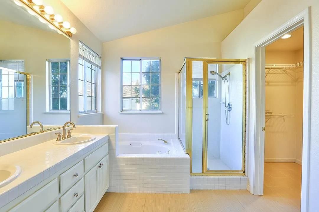 Bathroom, Dual Sink Vanities, Glass Shower, Interior, Recessed Lighting, Tile Countertops, Wood Texture Flooring