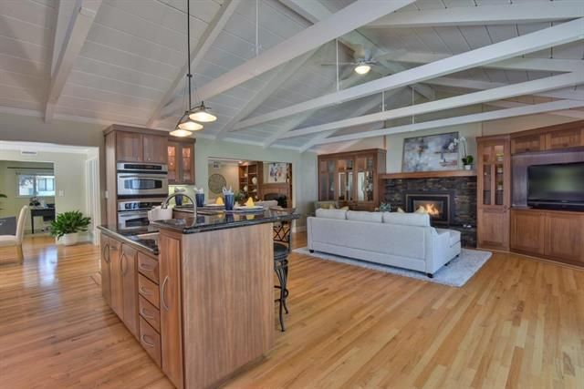 Fireplace, Interior, Kitchen, Living room, Pendant Lights, Stainless Steel Appliances, Wood Texture Flooring