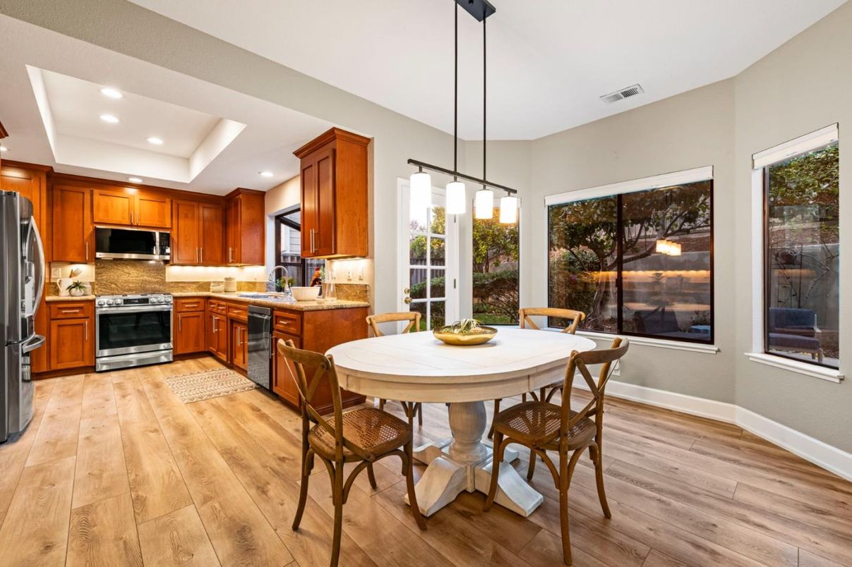 Dining room, Interior, Kitchen, Pendant Lights, Recessed Lighting, Stainless Steel Appliances, Wood Texture Flooring