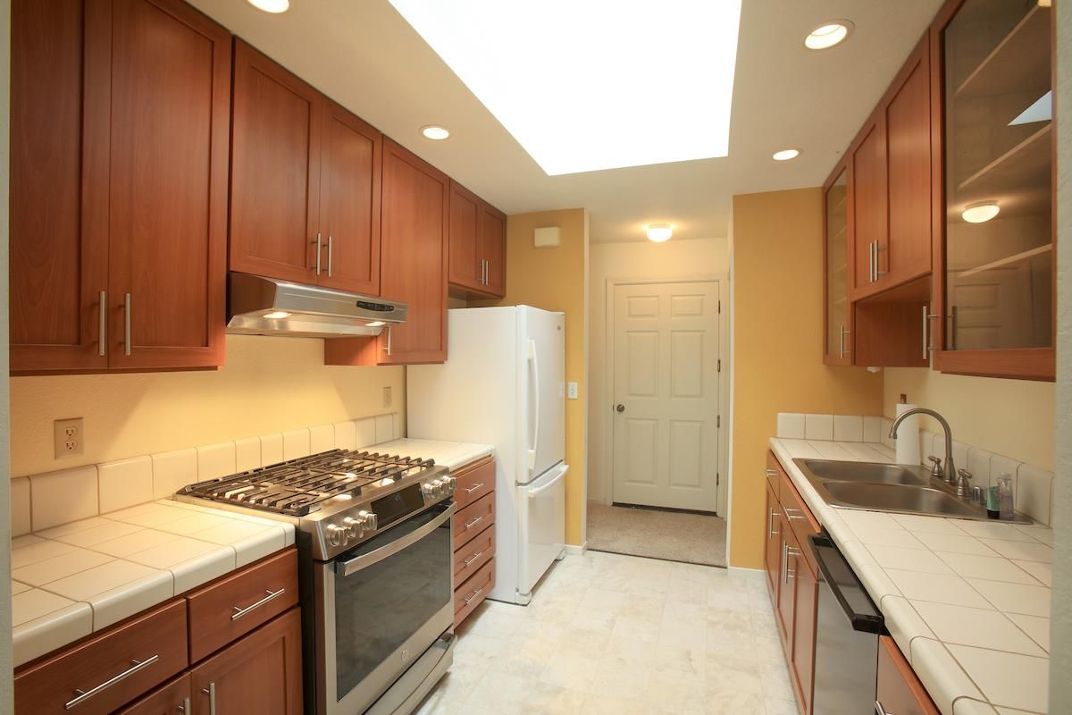 Interior, Kitchen, Recessed Lighting, Stainless Steel Appliances, Tile Countertops
