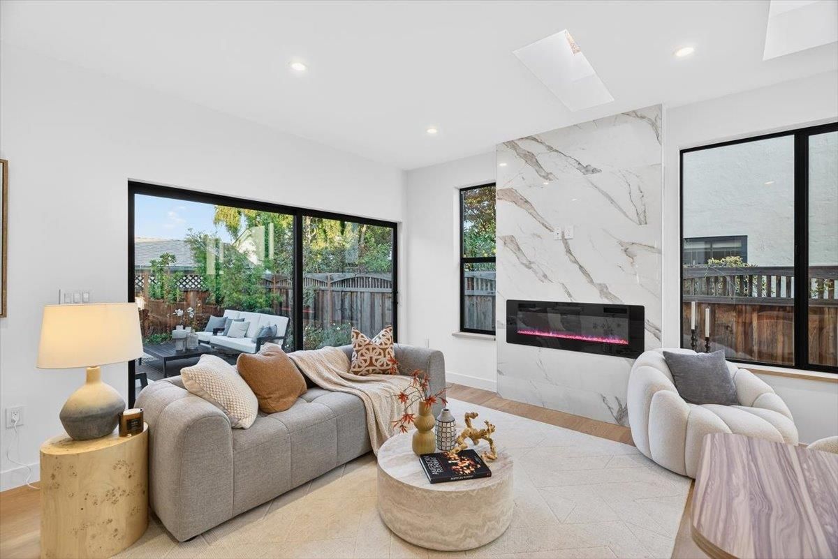 Fireplace, Interior, Living room, Marble Walls, Recessed Lighting, Wood Texture Flooring