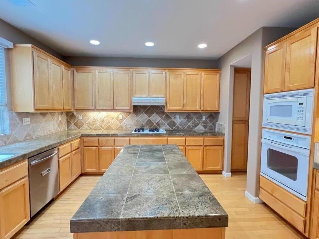 Interior, Kitchen, Recessed Lighting, Tile Countertops, Wood Texture Flooring