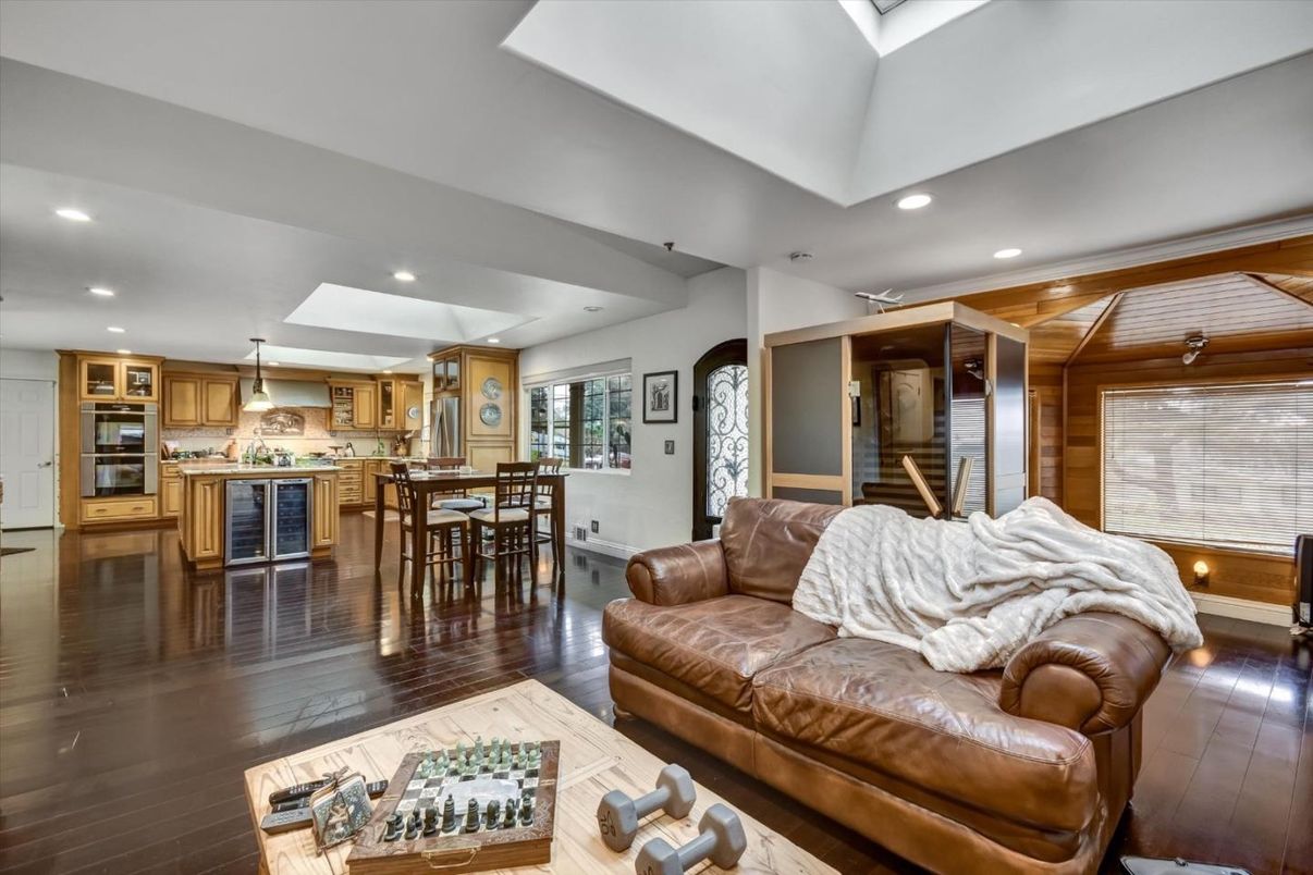 Dining room, Interior, Kitchen, Living room, Pendant Lights, Recessed Lighting, Stainless Steel Appliances, Wooden Ceilings, Wood Texture Flooring