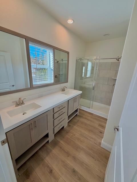 Bathroom, Dual Sink Vanities, Glass Shower, Interior, Recessed Lighting, Wood Texture Flooring