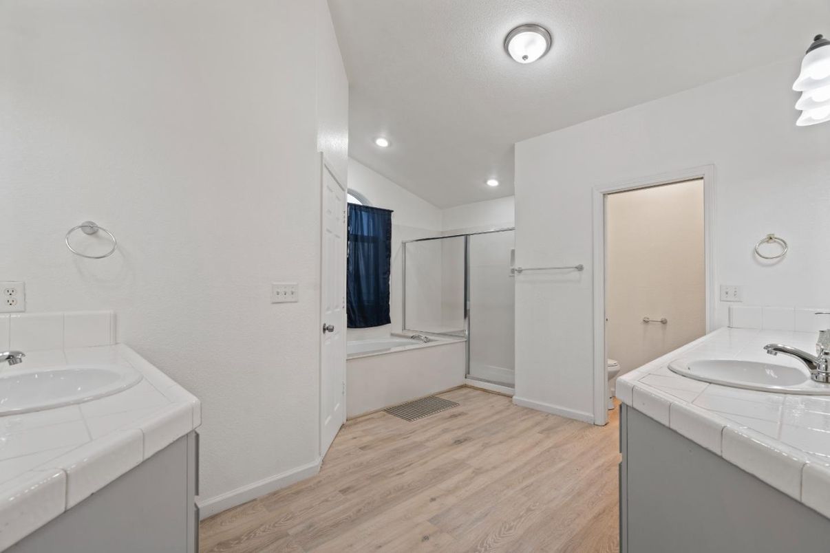 Bathroom, Dual Sink Vanities, Interior, Recessed Lighting, Tile Countertops, Wood Texture Flooring