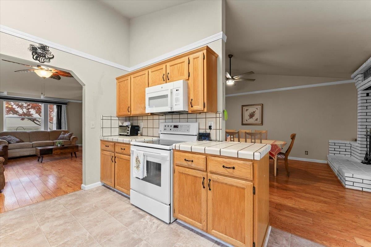 Dining room, Interior, Kitchen, Living room, Tile Countertops, Wood Texture Flooring