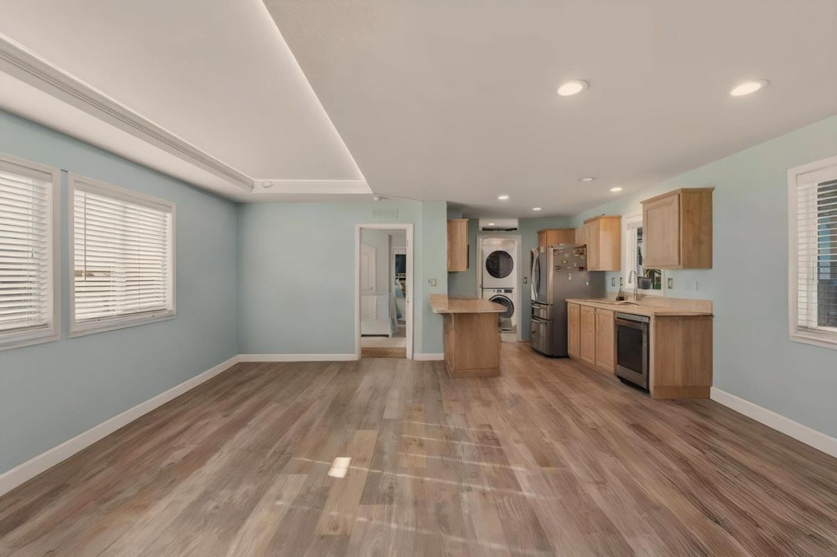 Interior, Kitchen, Recessed Lighting, Washer, Wood Texture Flooring