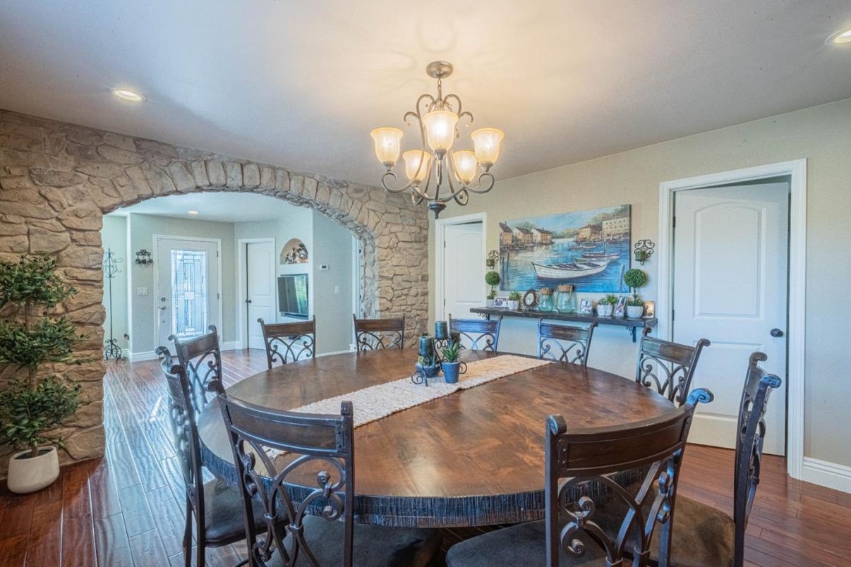 Chandelier, Dining room, Interior, Recessed Lighting, Stone Walls, Wood Texture Flooring