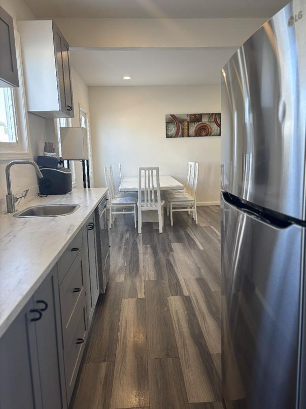 Dining room, Interior, Kitchen, Recessed Lighting, Stainless Steel Appliances, Wood Texture Flooring