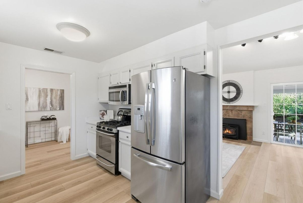 Fireplace, Interior, Kitchen, Stainless Steel Appliances, Wood Texture Flooring