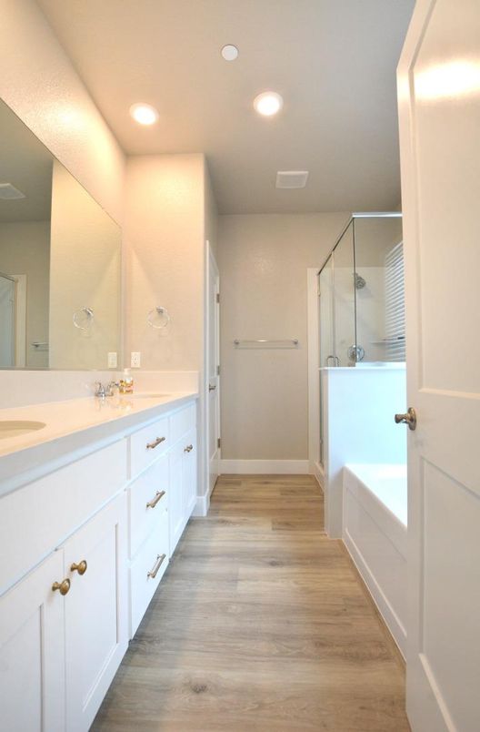 Bathroom, Dual Sink Vanities, Glass Shower, Interior, Recessed Lighting, Wood Texture Flooring