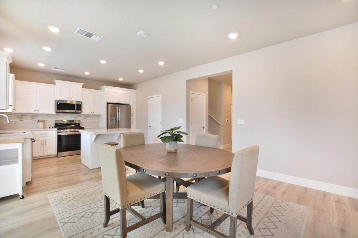 Dining room, Interior, Kitchen, Recessed Lighting, Stainless Steel Appliances, Wood Texture Flooring