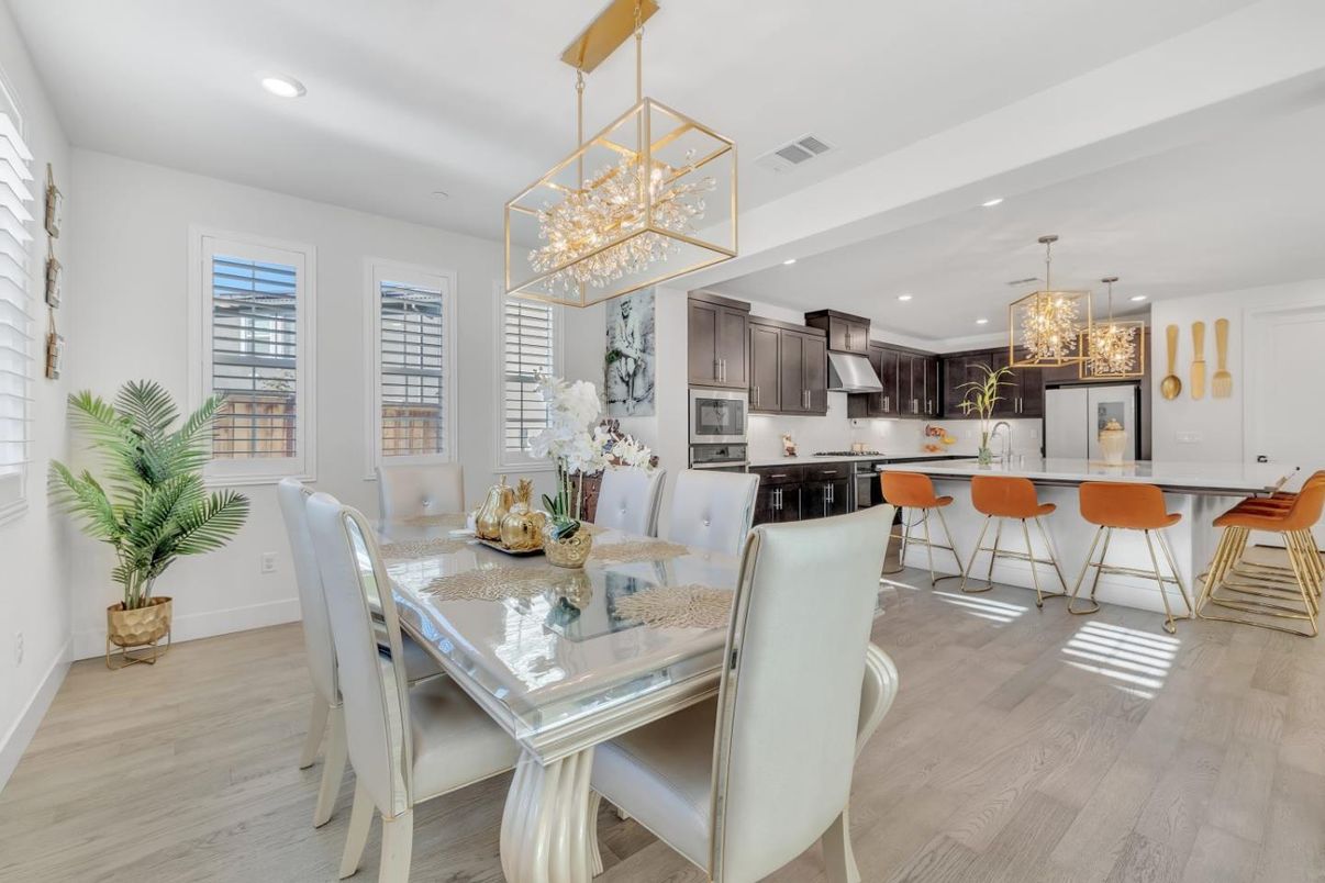 Chandelier, Dining room, Interior, Kitchen, Pendant Lights, Recessed Lighting, Stainless Steel Appliances, Wood Texture Flooring