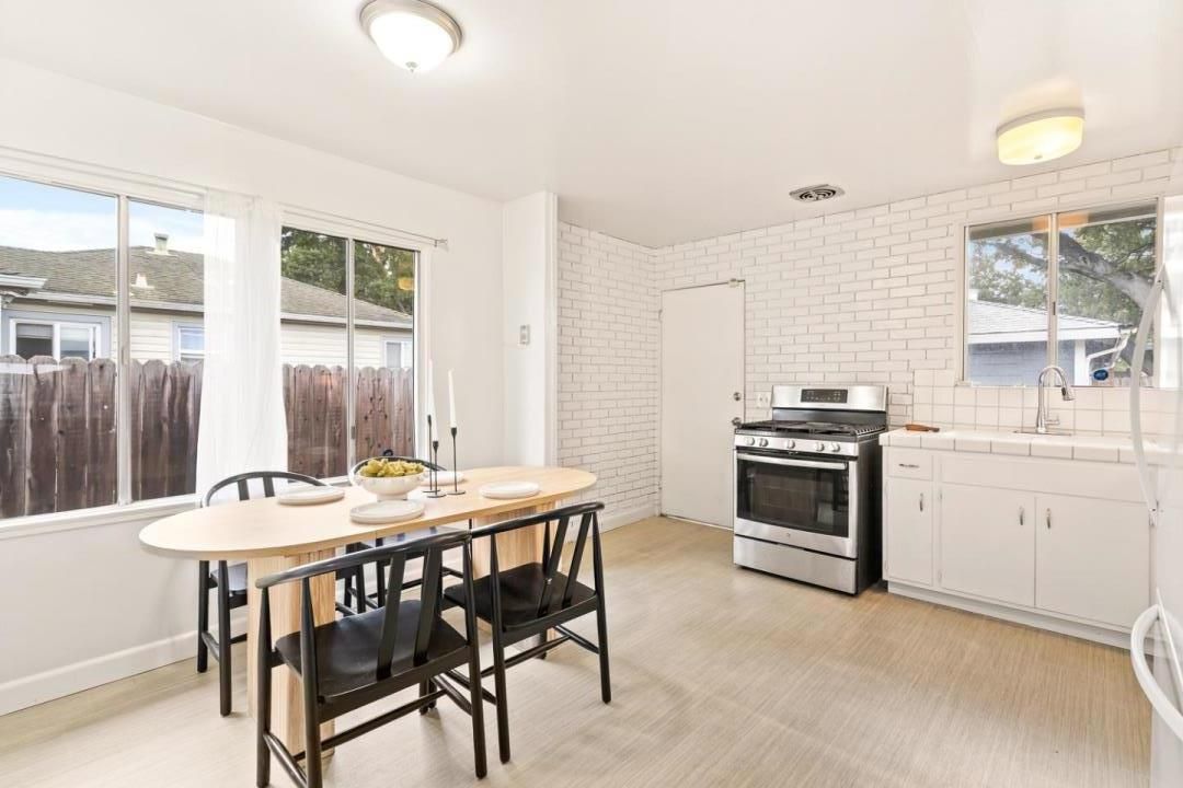 Dining room, Interior, Kitchen, Stainless Steel Appliances, Tile Countertops, Wood Texture Flooring