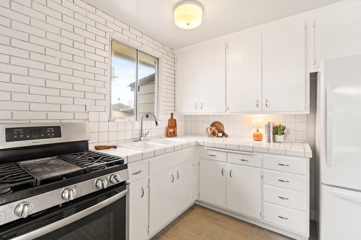 Interior, Kitchen, Stainless Steel Appliances, Tile Countertops, Wood Texture Flooring