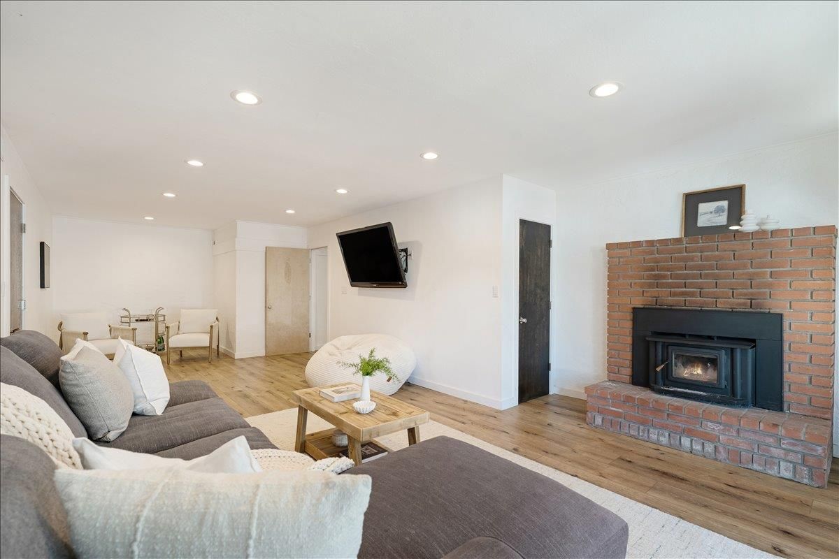 Fireplace, Interior, Living room, Recessed Lighting, Stone Walls, Wood Texture Flooring