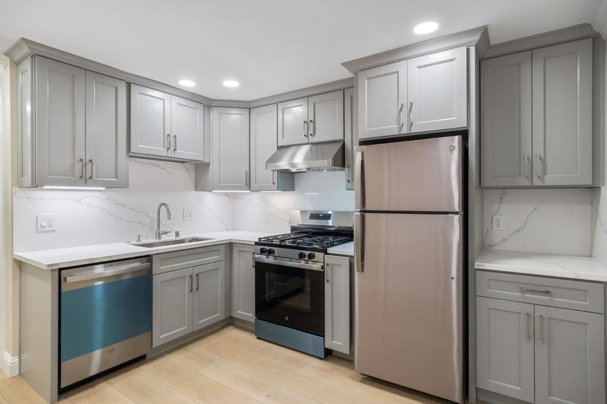 Interior, Kitchen, Marble Walls, Recessed Lighting, Stainless Steel Appliances, Wood Texture Flooring