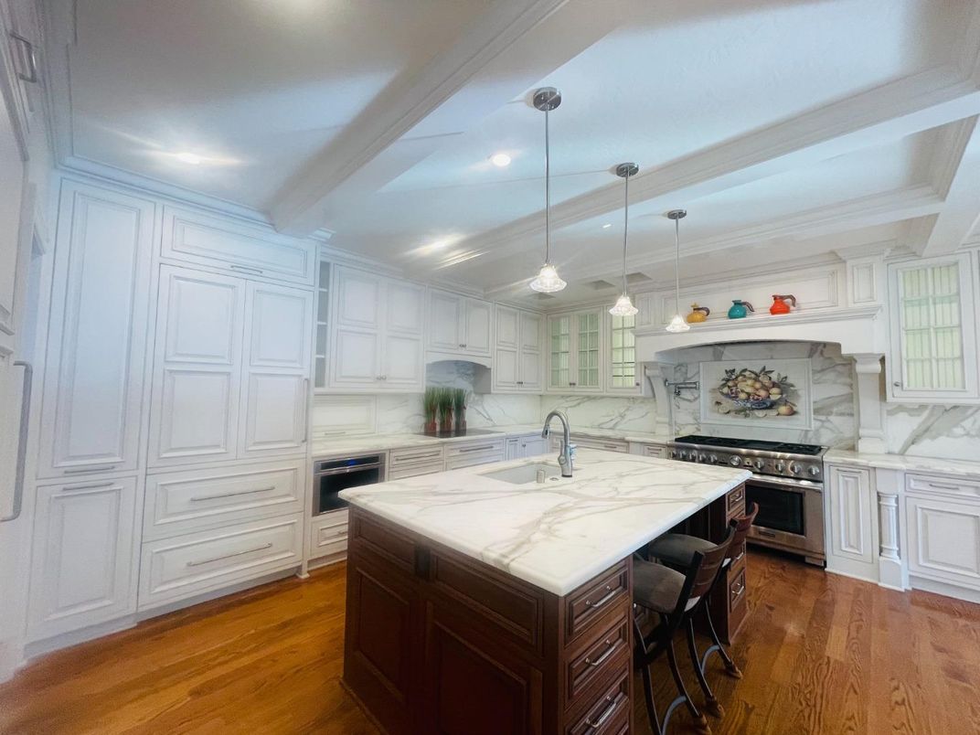 Interior, Kitchen, Marble Walls, Pendant Lights, Recessed Lighting, Stainless Steel Appliances, Wood Texture Flooring