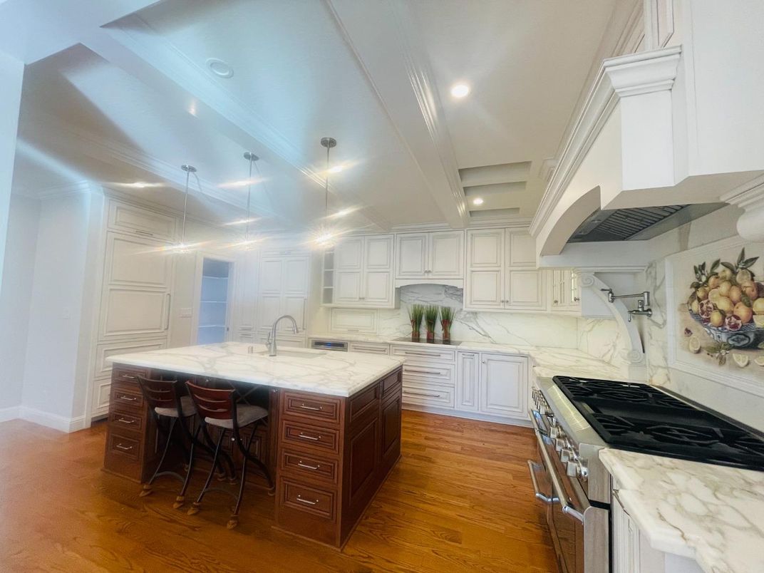 Interior, Kitchen, Marble Walls, Recessed Lighting, Stainless Steel Appliances, Wood Texture Flooring