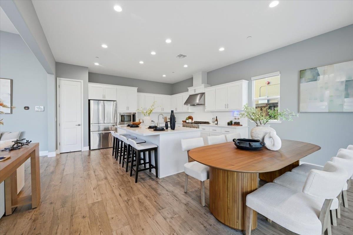 Dining room, Interior, Kitchen, Recessed Lighting, Stainless Steel Appliances, Wood Texture Flooring