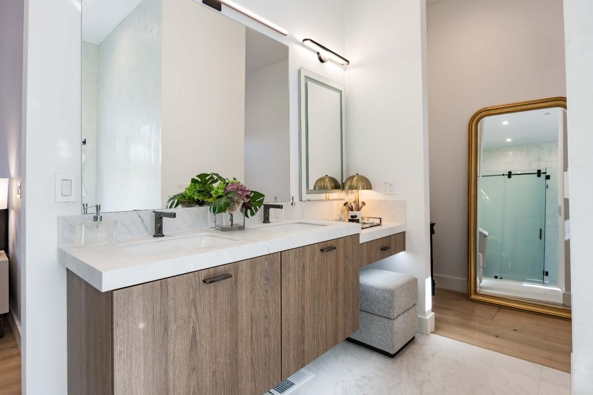 Bathroom, Dual Sink Vanities, Glass Shower, Interior, Marble, Recessed Lighting, Wood Texture Flooring