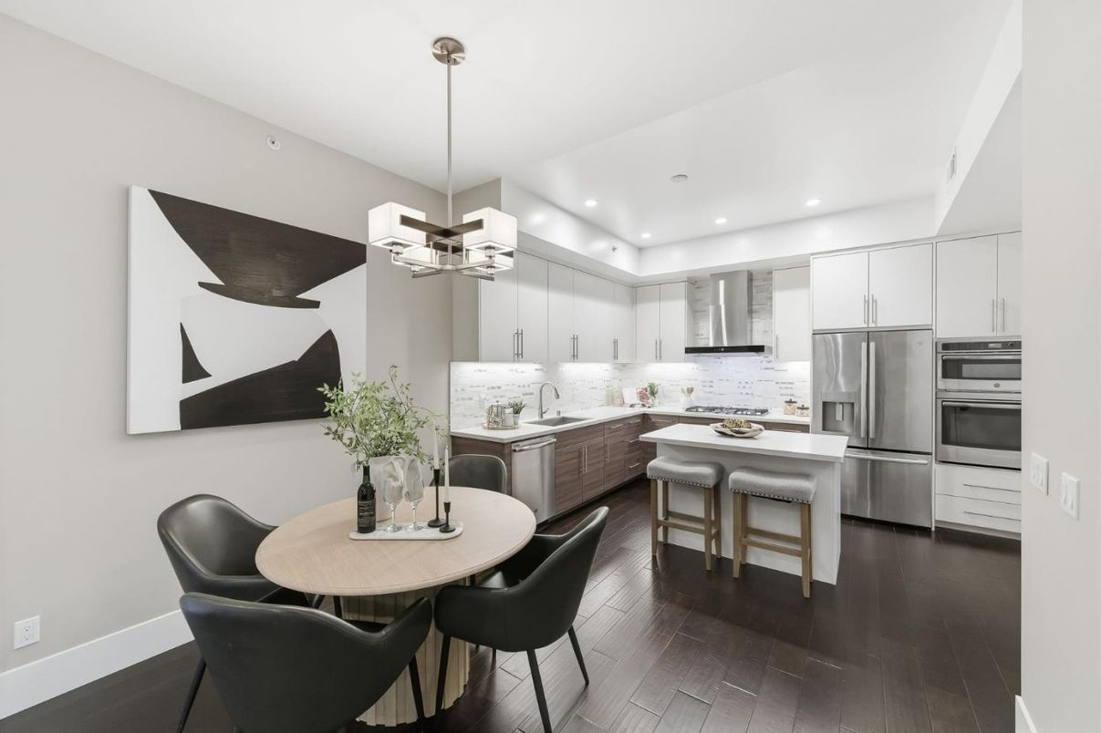 Chandelier, Dining room, Interior, Kitchen, Pendant Lights, Recessed Lighting, Stainless Steel Appliances, Wood Texture Flooring