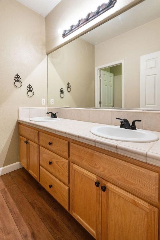 Bathroom, Dual Sink Vanities, Interior, Tile Countertops, Wood Texture Flooring