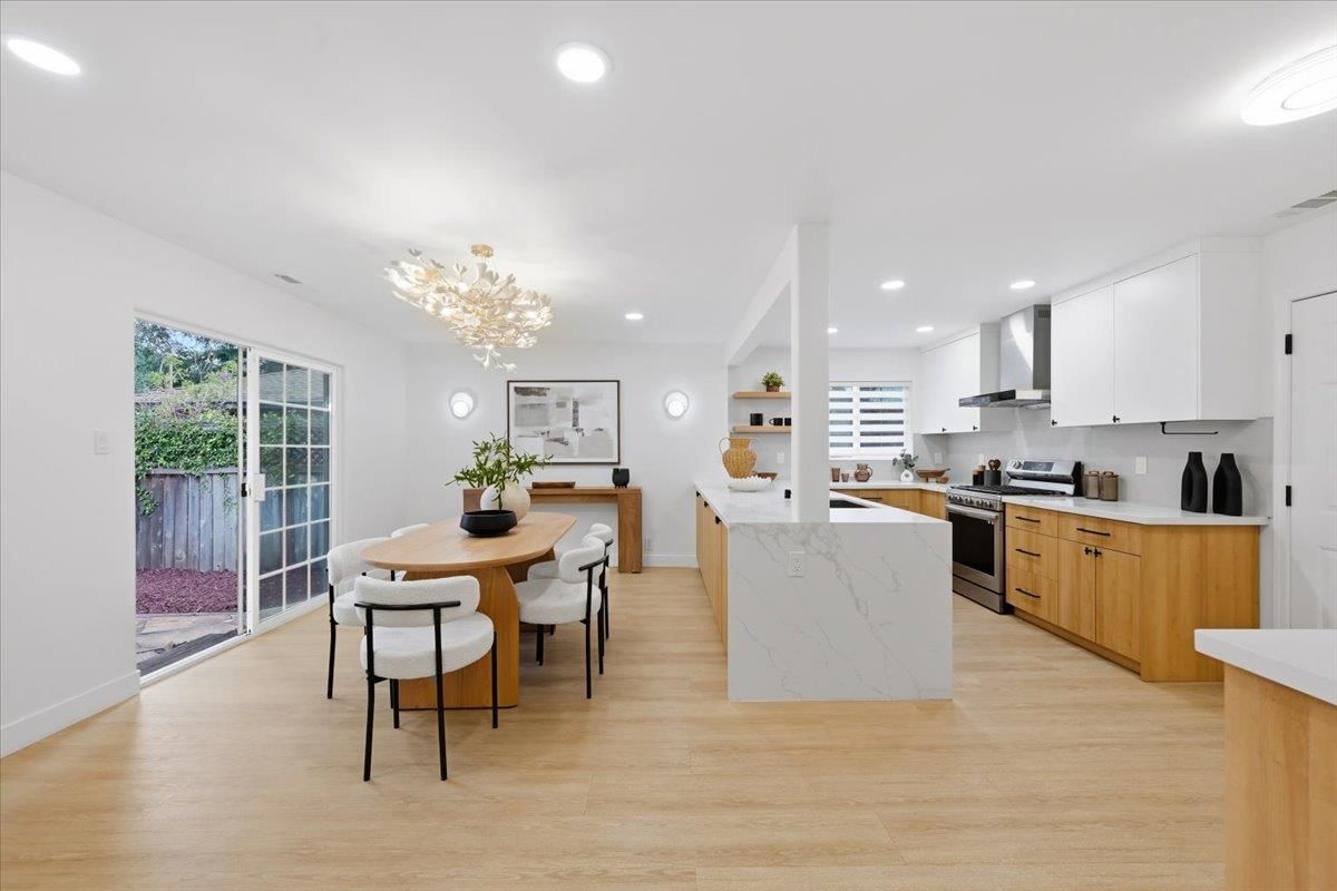 Chandelier, Dining room, Interior, Kitchen, Pendant Lights, Recessed Lighting, Stainless Steel Appliances, Wood Texture Flooring