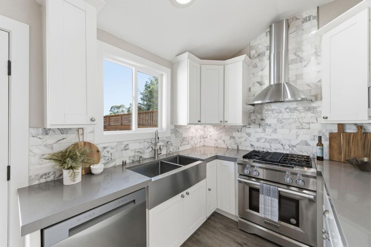 Interior, Kitchen, Marble Walls, Recessed Lighting, Stainless Steel Appliances, Wood Texture Flooring