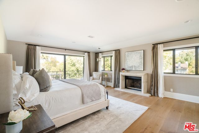 Bedroom, Fireplace, Interior, Pendant Lights, Recessed Lighting, Wood Texture Flooring