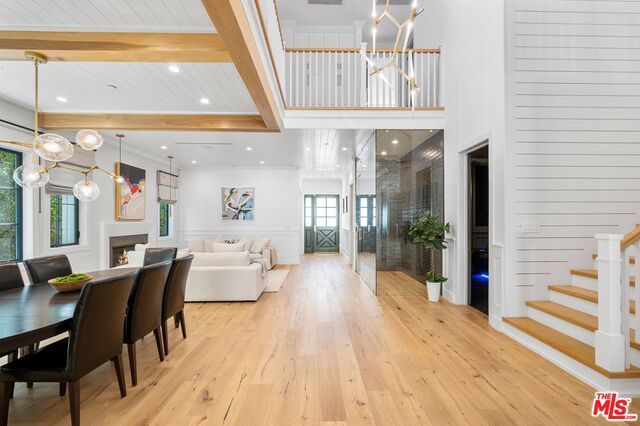Dining room, Fireplace, Interior, Living room, Pendant Lights, Recessed Lighting, Wooden Beams, Wood Texture Flooring