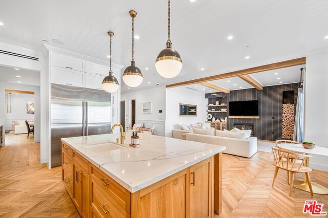 Fireplace, Interior, Kitchen, Living room, Pendant Lights, Recessed Lighting, Stainless Steel Appliances, Wooden Beams, Wood Texture Flooring