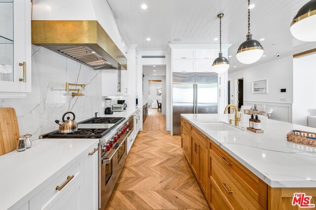 Interior, Kitchen, Marble Walls, Pendant Lights, Recessed Lighting, Stainless Steel Appliances, Wood Texture Flooring