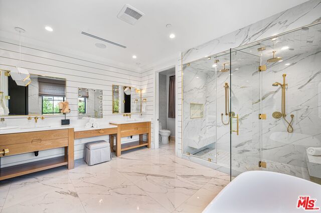 Bathroom, Dual Sink Vanities, Free Standing Baths, Glass Shower, Interior, Marble, Marble Walls, Pendant Lights, Recessed Lighting