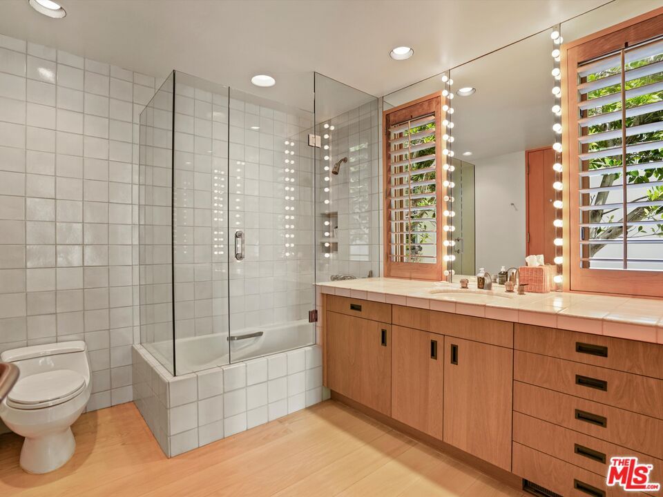 Bathroom, Glass Shower, Interior, Recessed Lighting, Tile Countertops, Wood Texture Flooring