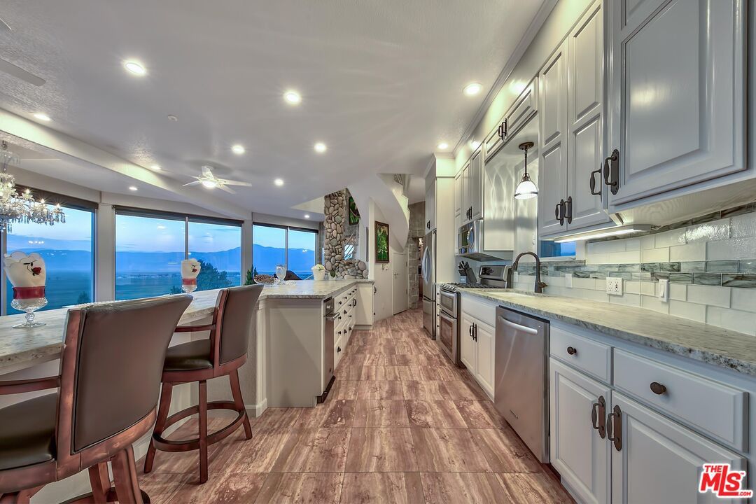 Interior, Kitchen, Recessed Lighting, Stainless Steel Appliances, Water, Wood Texture Flooring