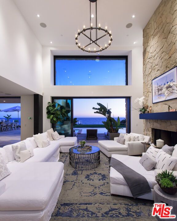 Chandelier, Fireplace, Interior, Living room, Pendant Lights, Recessed Lighting, Stone Walls, Water