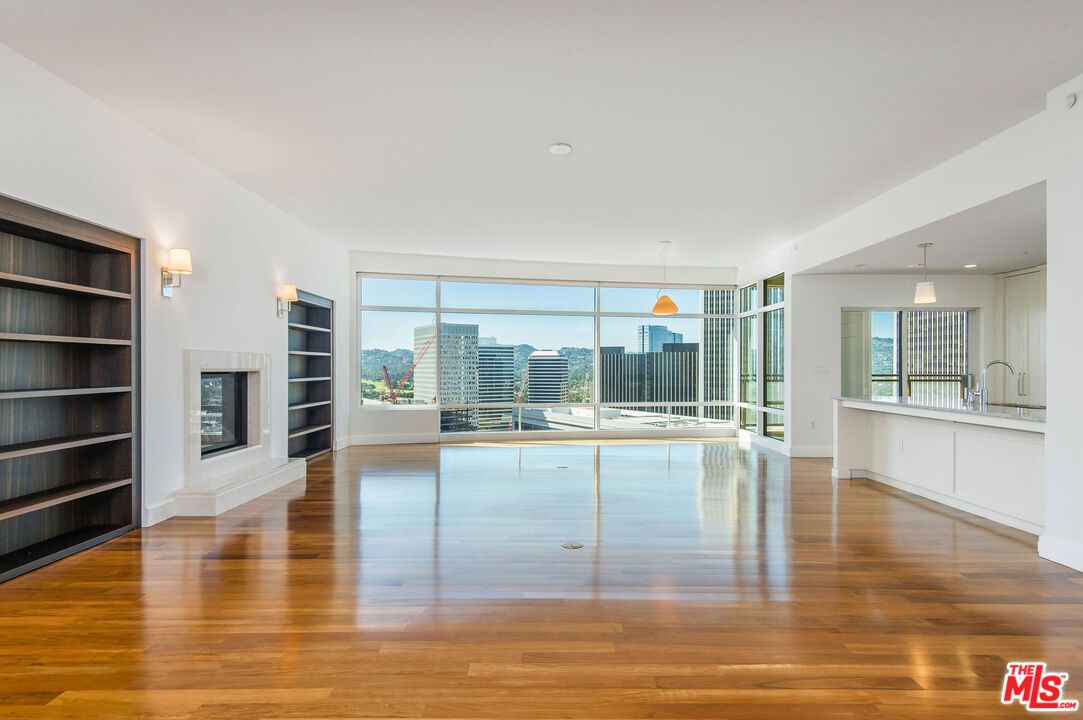 Empty room, Fireplace, Interior, Kitchen, Pendant Lights, Recessed Lighting, Wood Texture Flooring