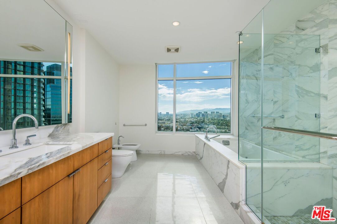 Bathroom, Dual Sink Vanities, Glass Shower, Interior, Marble, Marble Walls, Recessed Lighting