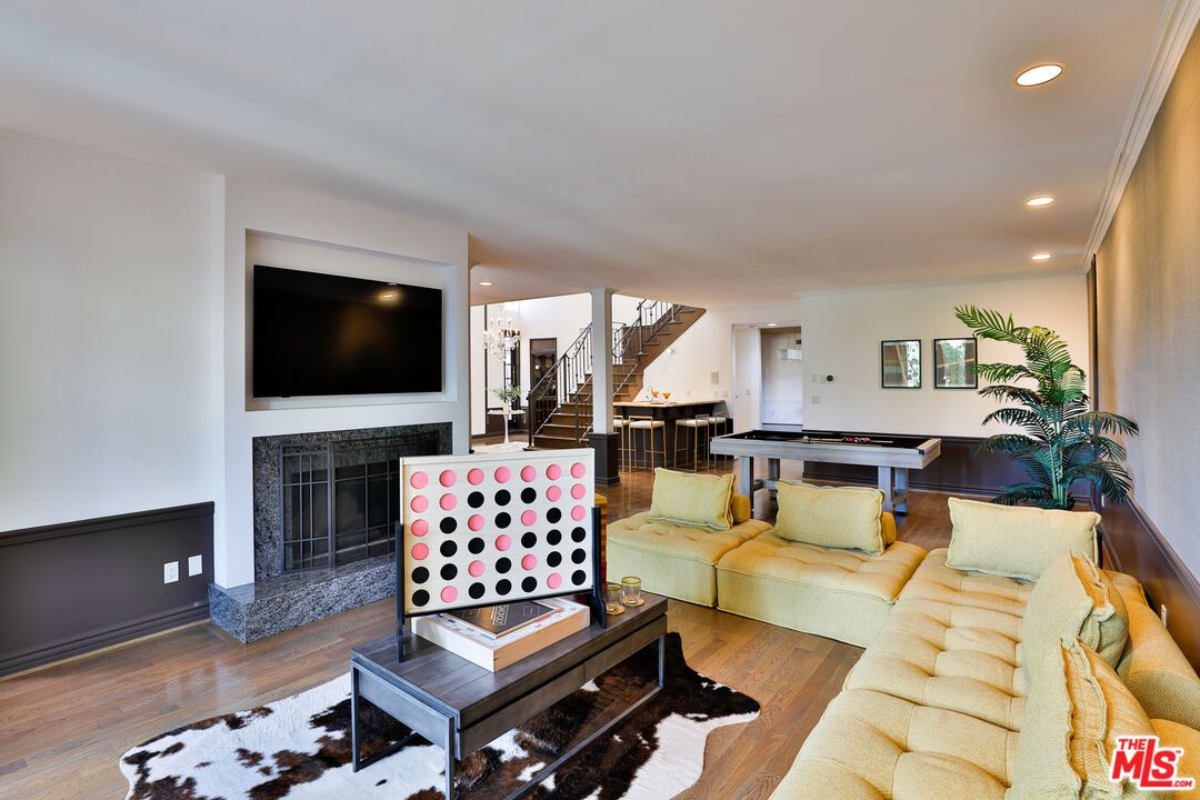 Billiard Table, Fireplace, Game Room, Interior, Living room, Recessed Lighting, Wood Texture Flooring