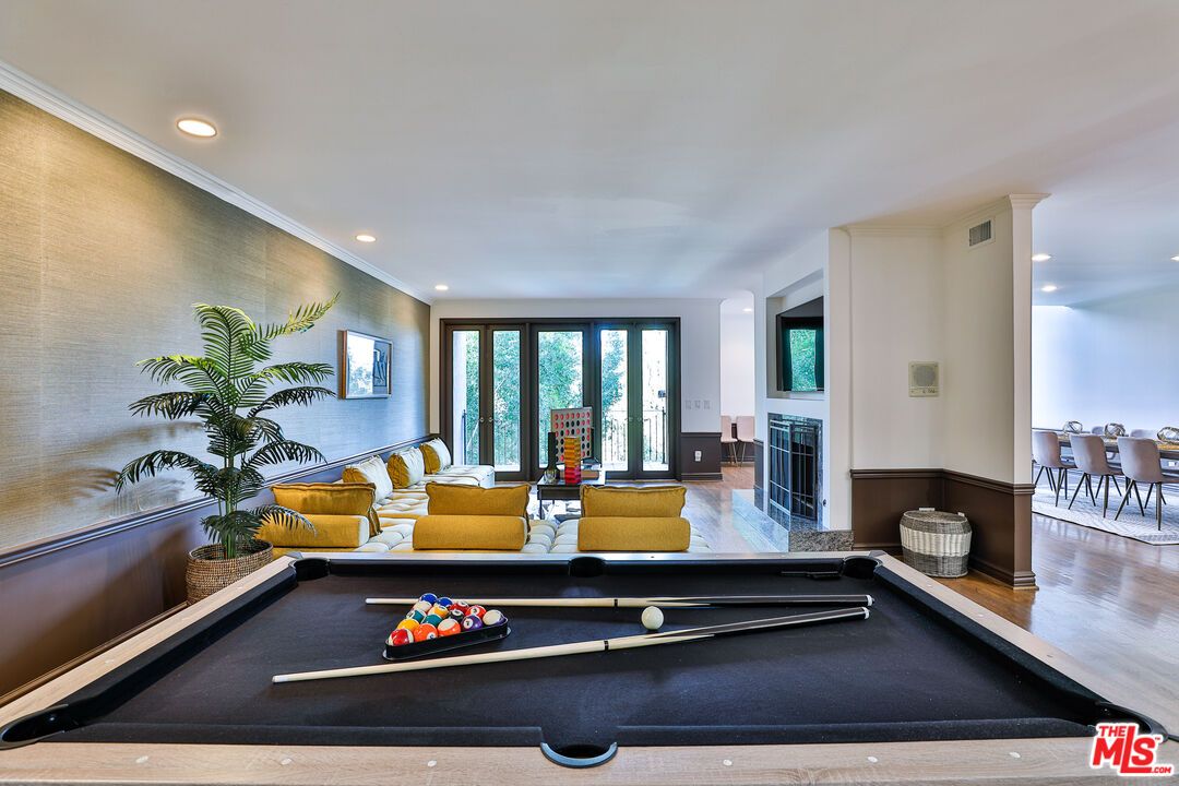 Billiard Table, Fireplace, Game Room, Interior, Living room, Recessed Lighting, Wood Texture Flooring
