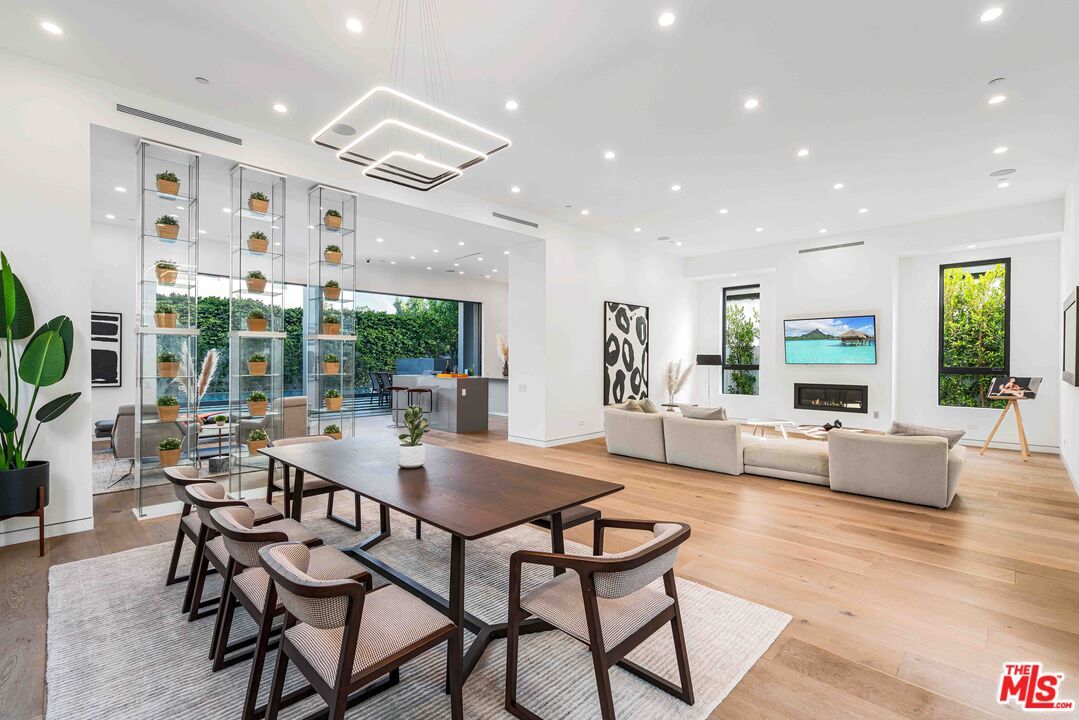 Dining room, Fireplace, Interior, Living room, Pendant Lights, Recessed Lighting, Wood Texture Flooring