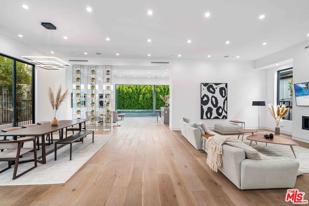 Dining room, Fireplace, Interior, Living room, Pendant Lights, Recessed Lighting, Wood Texture Flooring