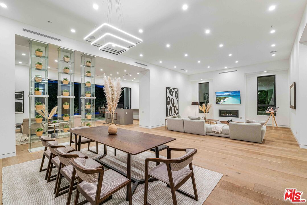 Dining room, Fireplace, Interior, Living room, Pendant Lights, Recessed Lighting, Wood Texture Flooring