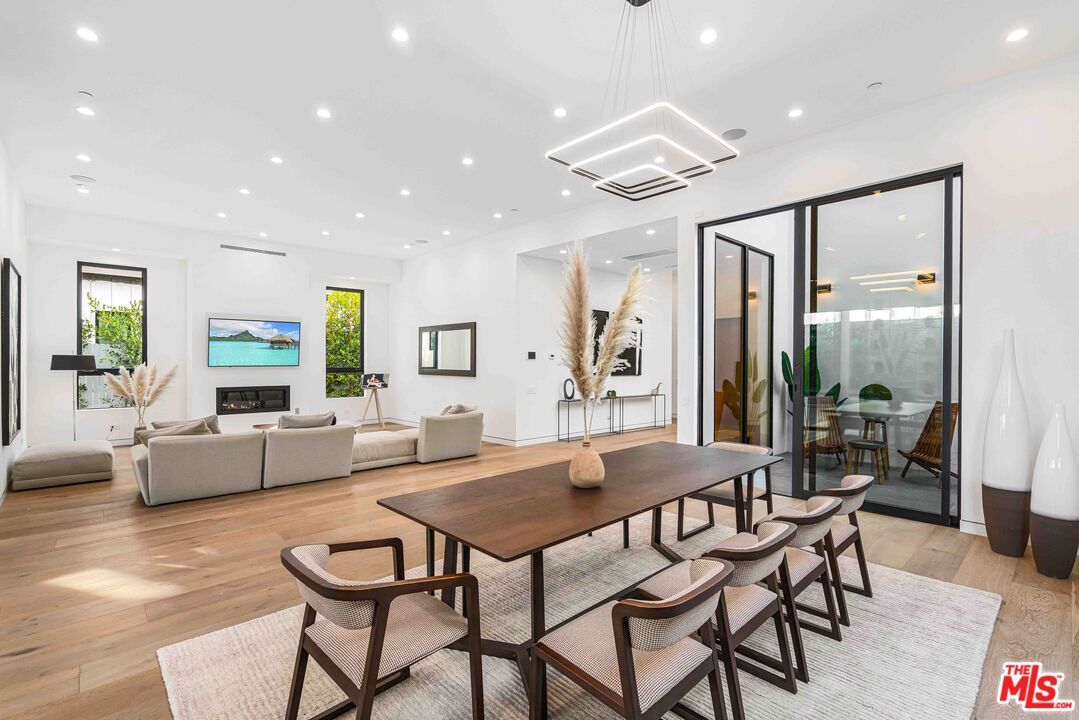 Dining room, Fireplace, Interior, Living room, Pendant Lights, Recessed Lighting, Wood Texture Flooring